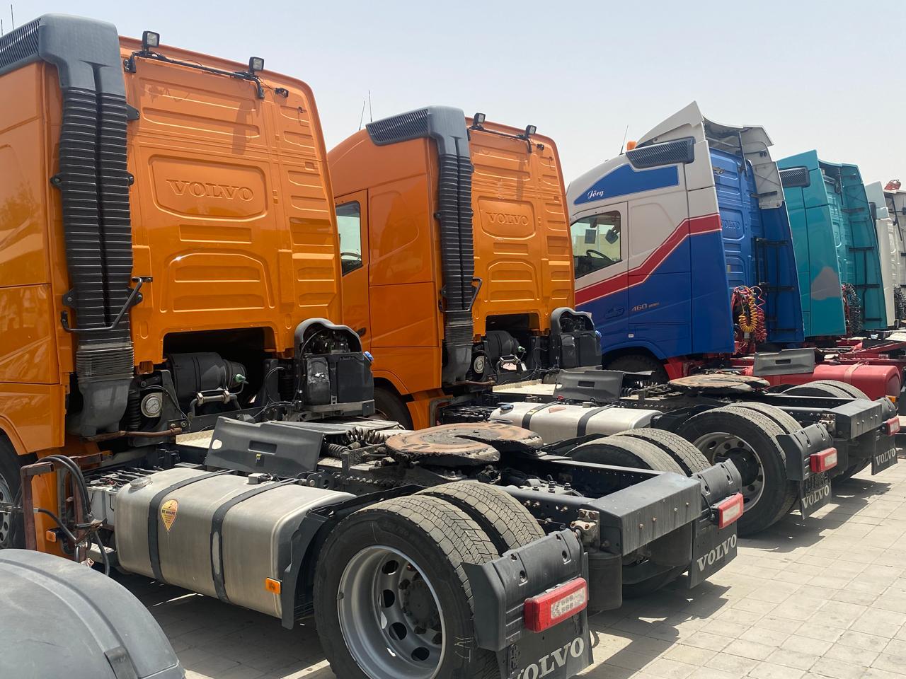 Volvo tractor units lined up rear view
